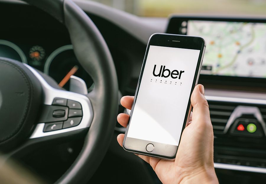 bigstock-Uber-Driver-Holding-Smartphone-345479947.jpg